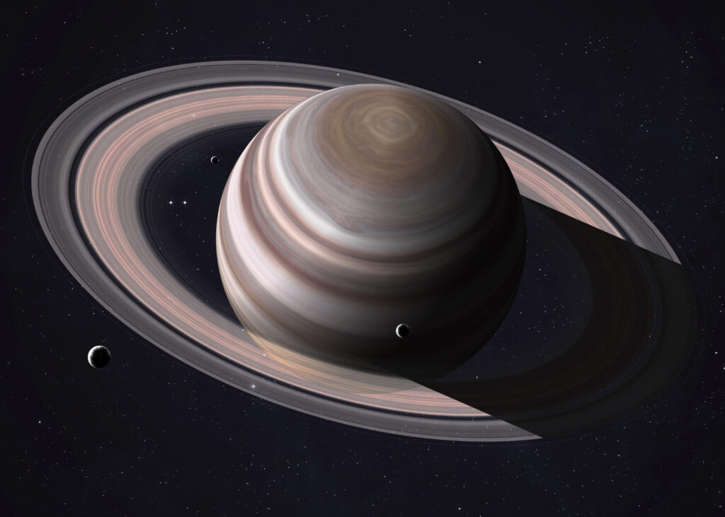 Ripresa colorata che mostra parte di Saturno e dei suoi anelli illuminati dai raggi del sole. Elementi di questa immagine forniti dalla NASA.