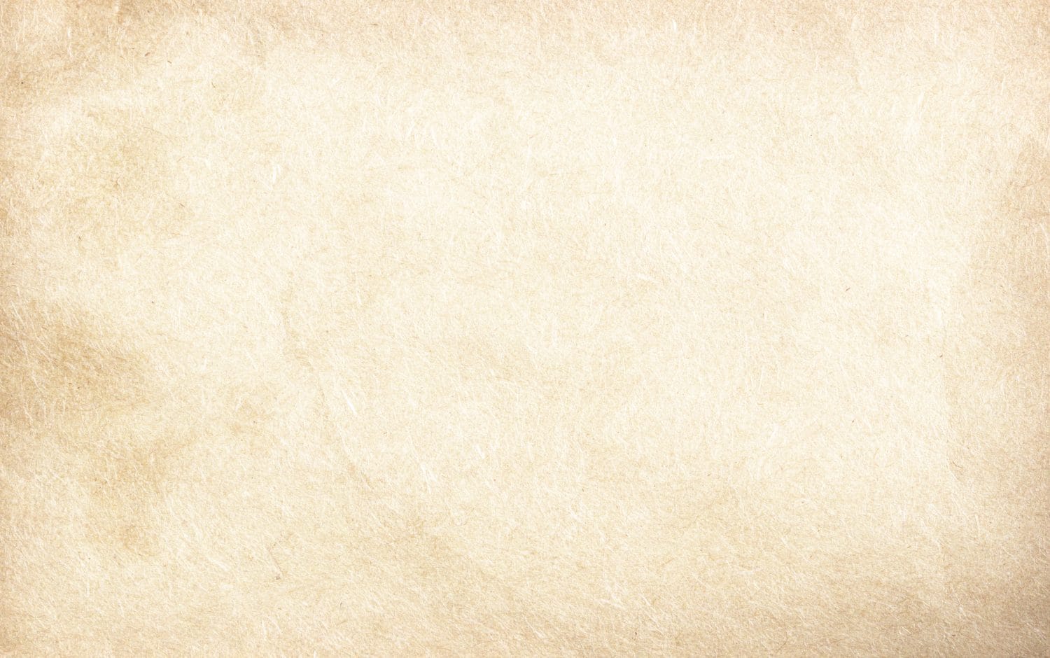 Vecchia carta vintage con un centro luminoso e una vignetta grunge.